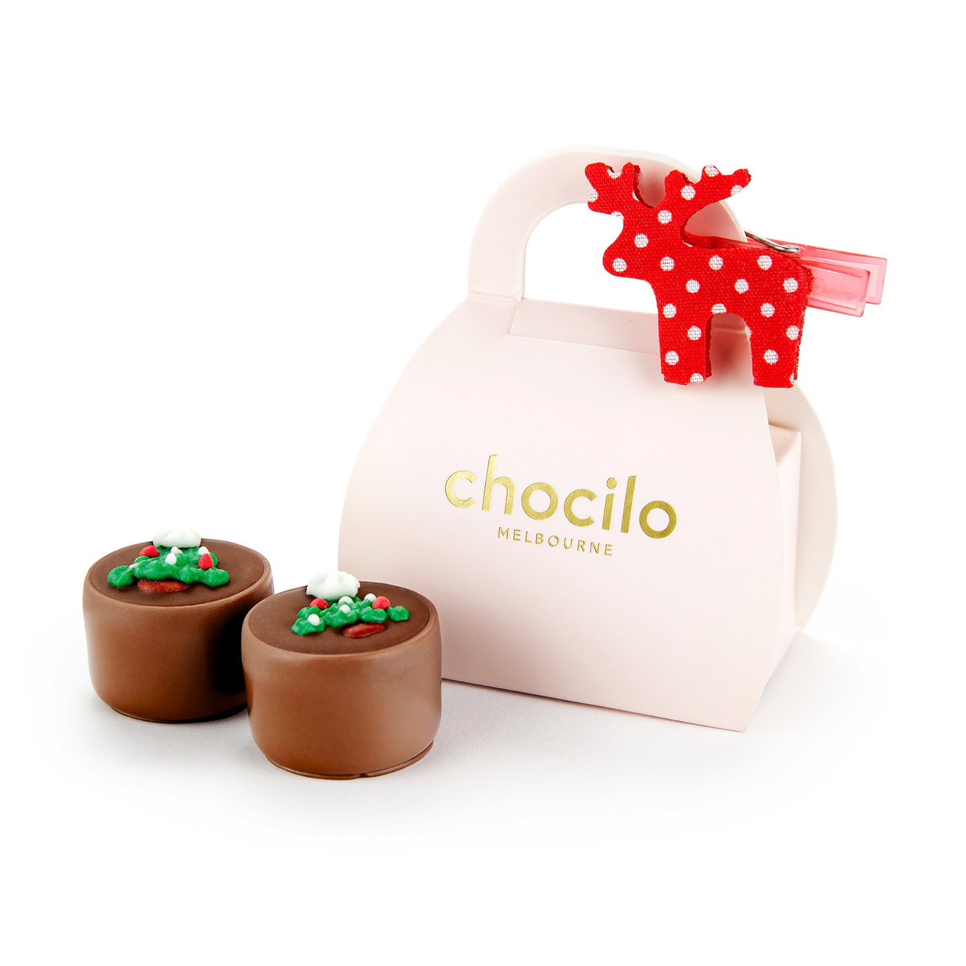 Chocilo Melbourne 2 Pack Christmas Milk Chocolate Caramels with a sugar decoration in a light pink cardboard handbag and a festive red and white reindeer clip.