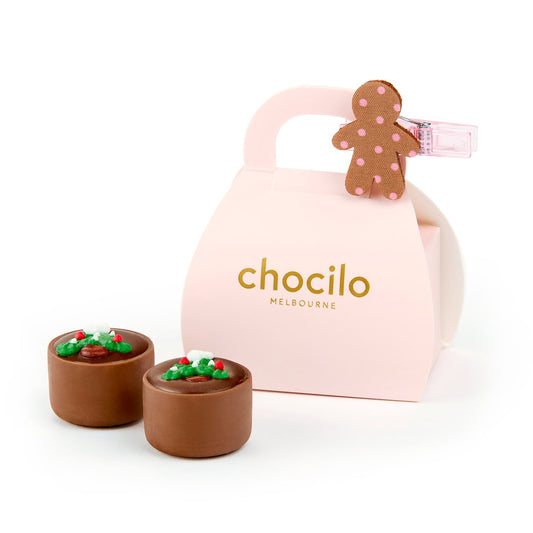 Chocilo Melbourne 2 Pack Christmas Milk Chocolate Caramels with a sugar decoration in a cardboard handbag and a cute gingerbread clip.