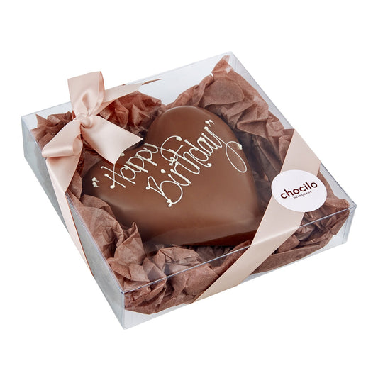 Chocilo Melbourne Handmade Milk Chocolate Heart with Happy Birthday Hand Piped in White Chocolate. Packaged in a clear gift box with ribbon.