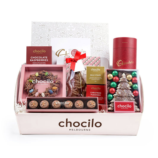 A Chocilo Melbourne Christmas chocolate gift hamper filled with assorted chocolates and festive treats, presented in a light pink box.