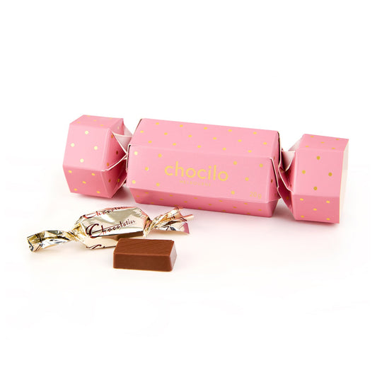 Chocilo Melbourne Pink and Gold Bon Bon Christmas Cracker with 4 wrapped solid milk chocolates.