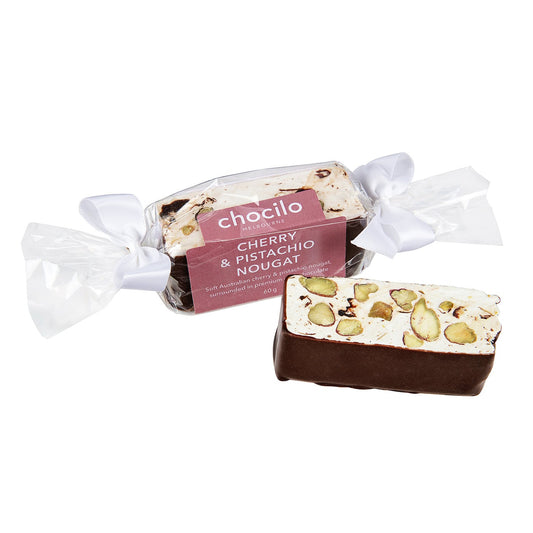 Chocilo Melbourne Cherry and Pistachio Nougat dipped in premium dark chocolate. Wrapped in clear cello like a bon bon, complete with white ribbons.