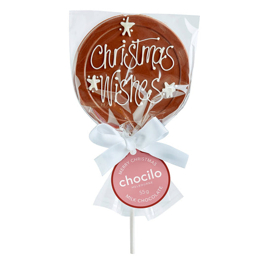 A milk chocolate lollipop with Christmas Wishes hand-piped in white chocolate, wrapped in clear cellophane packaging with a white bow and a swing tag.