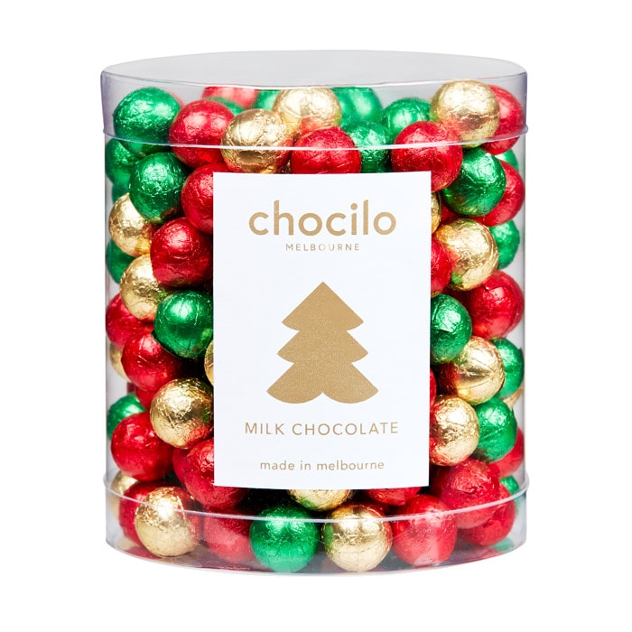 Chocilo Melbourne 1kg Assorted Christmas Foiled Solid Milk Chocolate Baubles in a clear counter tub