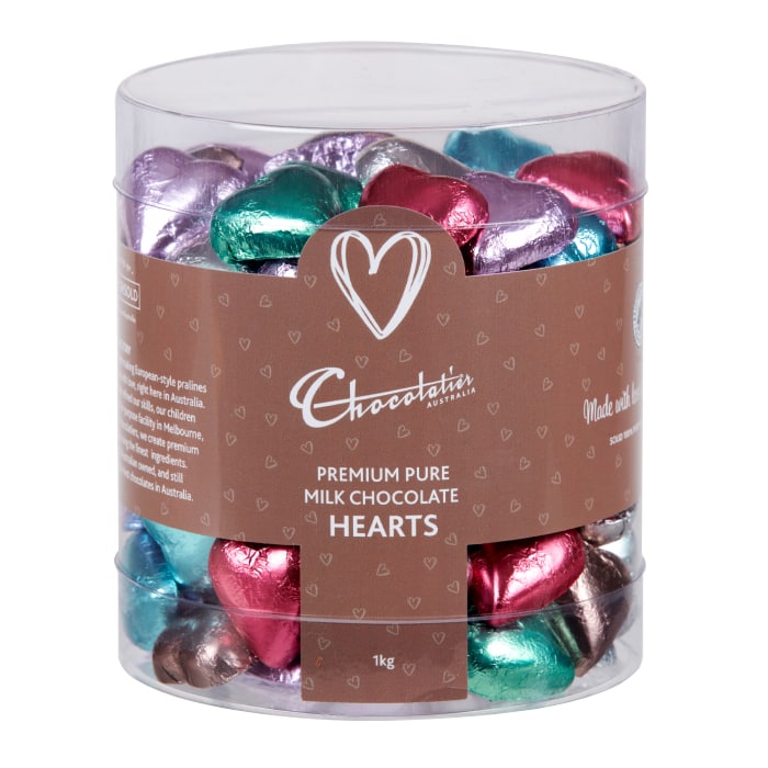 Chocolatier Australia Pink Foiled Hearts in Milk Chocolate. Packed into a clear tub for display.