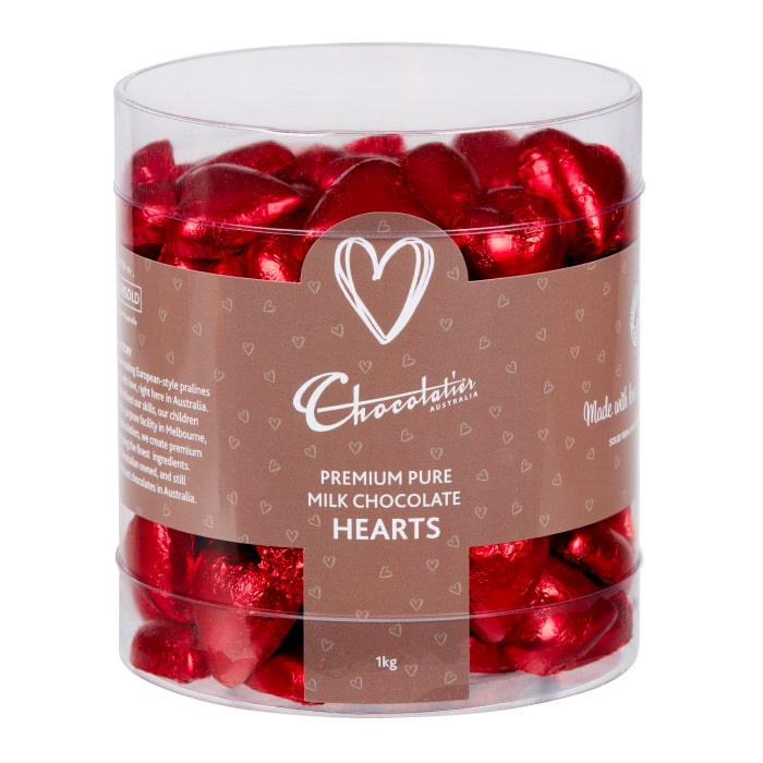 Chocolatier Australia Red Foiled Hearts in Milk Chocolate. Packed into a clear tub for display.